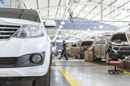 Auto repair service. Automobile special workers auto service station garageの写真素材
