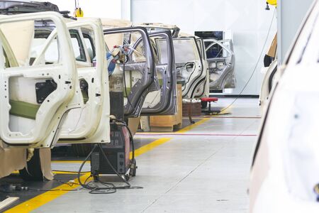 Auto repair service. Automobile special workers auto service station garageの写真素材