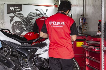 Lima, Peru - December 14, 2019: Motorbike is repaired and selling in Motoparttoto Yamaha shop, common shop in Limaのeditorial素材