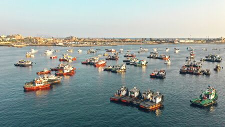 Beautiful sunset at sea, there are fishing boats in the water. fishermen near Natural Area Marina peru callao.のeditorial素材
