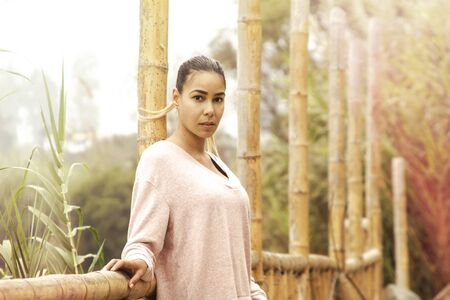 Beautiful profile portrait. Young girl, autumnal mood, sky outside the city. The port is abrasive against the bottom. Romantic mood that affectsの写真素材