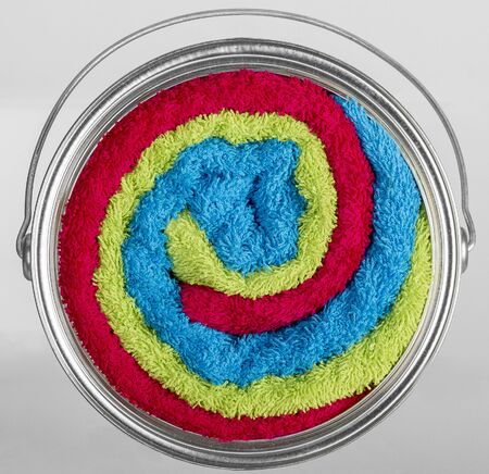 Can of paint mixing colors and textures, bath towels mixの写真素材