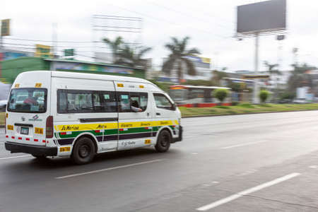 Lima, Peru - April 8 2020: Bus passengers wearing a mask, public transportation in Lima amid a coronavirus outbreak.のeditorial素材