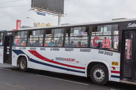 Lima, Peru - April 8 2020: Bus passengers wearing a mask, public transportation in Lima amid a coronavirus outbreak.のeditorial素材