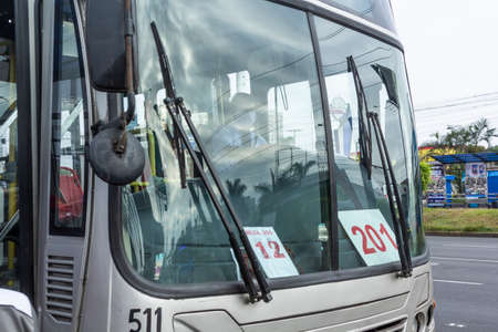 Lima, Peru - April 8 2020: Bus passengers wearing a mask, public transportation in Lima amid a coronavirus outbreak.のeditorial素材