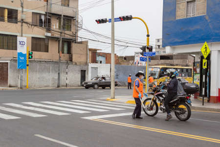 Lima, Peru - April 8, 2020: Control point with army, military and municipal police to verify circulation permit in curfew by covid coronavirus outbreak in south America.のeditorial素材