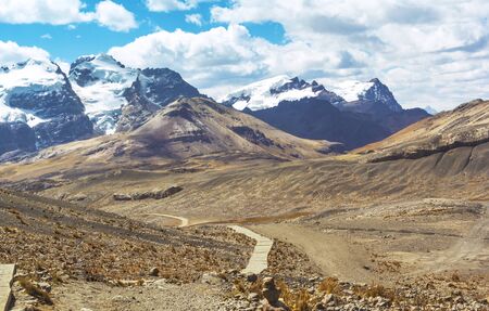 Beautiful trail from the mountain range in the Andean mountains to the Pastoruri glacier, in the Huascarán National Park, Huaraz / Peru. Tropical glacier at 5200 meters above sea level.の写真素材