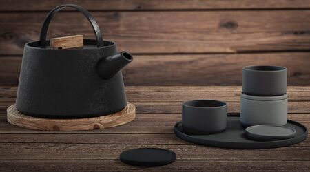 Modern black cast iron teapot and tea cups and a minimalist table. side view, set for tea time. 3d rendering.の写真素材