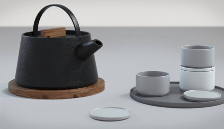 Modern black cast iron teapot and tea cups and a minimalist table white. side view, set for tea time. 3d rendering.の写真素材