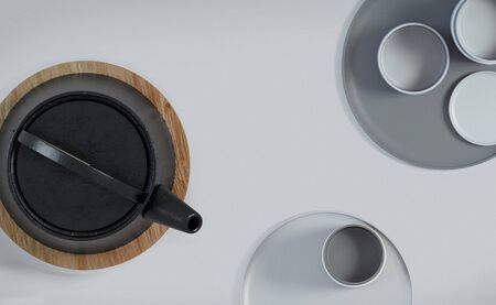 Modern black cast iron teapot and tea cups and a minimalist table wood white. Top view, set for tea time. 3d rendering.の写真素材