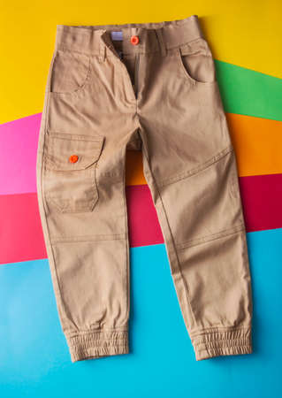 Top view fashion trendy look of boys clothes and shoes, fashion concept, outfit, colors background, Stylish child look.の写真素材