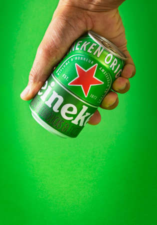 Lima, Peru - August 10 2020: Heineken beer can green background. Heineken beer is the flagship product of Heineken International.のeditorial素材