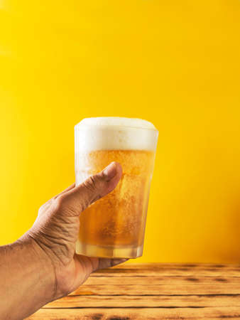 Hand with beer tosting, selective focus.の写真素材