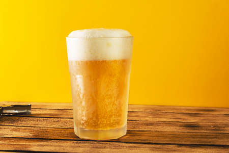 Beer glass, bottle beer on a wooden background, selective focus.の写真素材