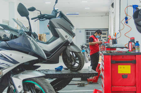 Lima, Peru - September 22, 2022: Motorbike is repaired and selling in Motoparttoto Yamaha shop, common shop in Lima.のeditorial素材