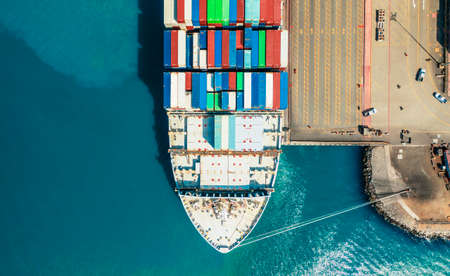 Aerial view container ship carrying container in import export business logistic and transportation...