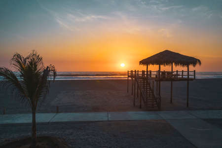 Silhouette of Typical Lifeguard tower station at sunset, Baywatch tower on the beach.の写真素材