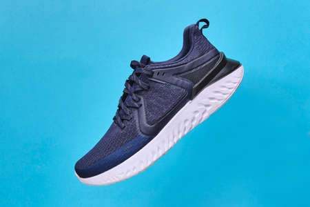 Shoes running Concept healthy lifestyle outfit, sport and diet. Top view, text space. Athlete's set. Flat lay composition, male and female fitness.の写真素材