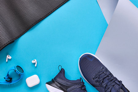 Concept healthy lifestyle outfit, sport and diet. Top view, text space. Athlete's set. Flat lay composition. Sports unisex, male and female fitness.の写真素材