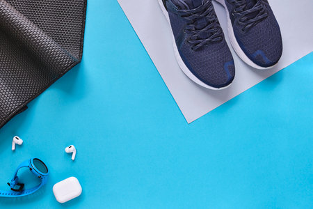 Concept healthy lifestyle outfit, sport and diet. Top view, text space. Athlete's set. Flat lay composition. Sports unisex, male and female fitness.の写真素材
