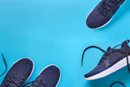 Shoes running Concept healthy lifestyle outfit, sport and diet. Top view, text space. Athlete's set. Flat lay composition, male and female fitness.の写真素材