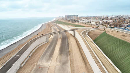 Lima, Peru - October 06, 2019: Aerial view of construction of highway Costa Verde, San Miguel district, road on the beach.のeditorial素材