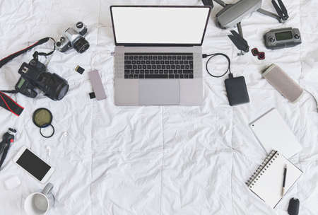Filmmaker equipment, blogger, work zone, freelance digital work implements, top view. Concept creative work, home office. Selective focus.の写真素材