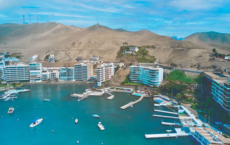 Aerial view of the bay, marina and buildings of Ancon - Lima, Peru; Summer area, The beach and some exterior buildings in Ancon.の写真素材