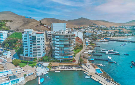 Aerial view of the bay, marina and buildings of Ancon - Lima, Peru; Summer area, The beach and some exterior buildings in Ancon.の写真素材