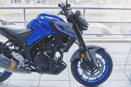 Lima, Peru - May 15, 2021: Yamaha motorcycle shop, Yamaha MT03 abs, Motorcycles in the showroom Yamaha shop. Store motorcycle, professional tools, selective focus.のeditorial素材