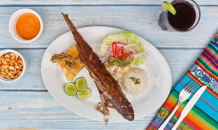 Peruvian cuisine: Cabrilla frita, fried fish. Selective Focusの写真素材