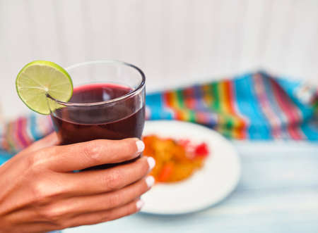 PERUVIAN PURPLE CORN DRINK. Chicha morada purple sweet traditional peruvian corn drink. , Woman...