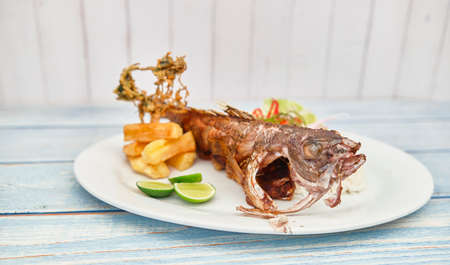 Peruvian cuisine: Cabrilla frita, fried fish. Selective Focus