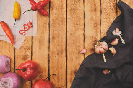 Peruvian ingredients: Rocoto Chili Which Has Been Sliced On A Wooden Board, chili AjÃ­ Limo, garlic and onionの写真素材