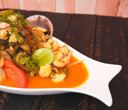 Peruvian food: called "sudado de seafood" seafood (fish sweat, mixed with vegetables and spicy juice.) Selective focusの写真素材