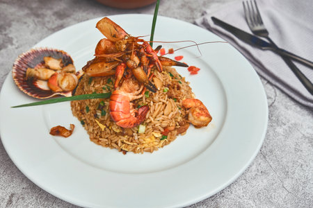 Peruvian food: called "Arroz chaufa" with seafood, fried rice, shrimp, scallops, octopus and squid. Selective focusの写真素材