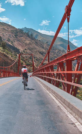 Photo of road cycling. Triathlete train in beautiful nature. Sea and mountains in the background. Matucana, Peruの写真素材