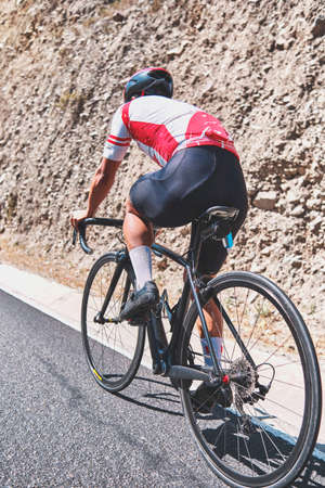 Photo of road cycling. Triathlete train in beautiful nature. Sea and mountains in the background. Matucana, Peruの写真素材