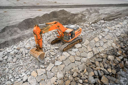 trucks do construction work on the background of the sea, top viewの写真素材