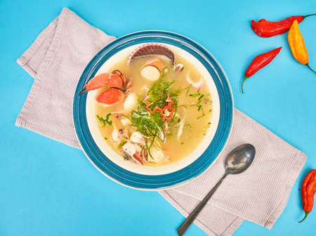 Delicious fish soup seafood called Chilcano Peruvian Food, decorated with crabs