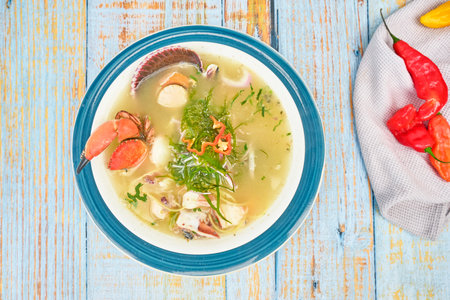 Delicious fish soup seafood called Chilcano Peruvian Food, decorated with crabsの写真素材