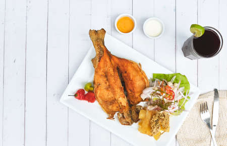 PERUVIAN FOOD, typical dish Fried trout, with rice, yucca and salad, Sective Focus