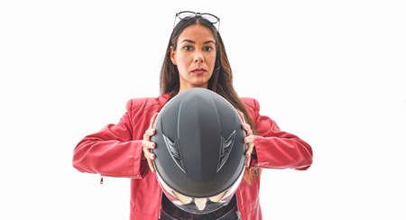 Beautiful empowered motorcyclist woman with modern look. Power woman conceptの写真素材