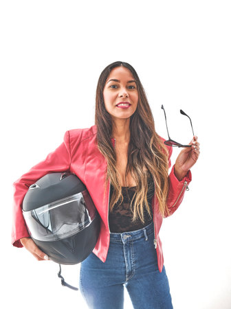 Beautiful empowered motorcyclist woman with modern look. Power woman conceptの写真素材