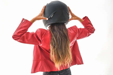 Beautiful empowered motorcyclist woman with modern look. Power woman conceptの写真素材