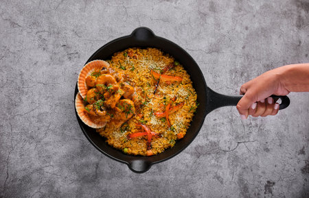 PERUVIAN FOOD: Rice with seafood. Arroz con Mariscos, food served in pan, Selective focus.の写真素材