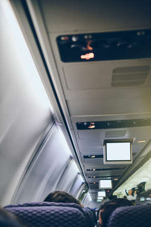Crop image of airplane screen device for entertainment to serve passenger. Flying with airplane. Travel concept.の写真素材