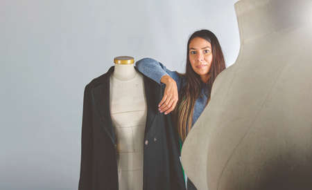 Young fashion designer working at home on a design or draft, Fashion Designer Stylish Showroom Concept.の写真素材