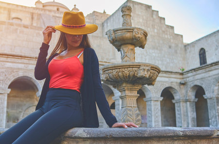 Tourist woman walking on vacation in street, Arequipa, Peru. Selective Focusの写真素材