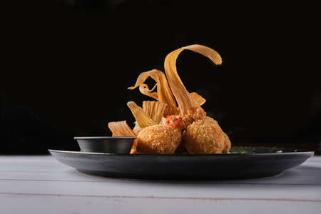 Gourmet corn croquettes, delicious Peruvian corn balls, selective focusの写真素材